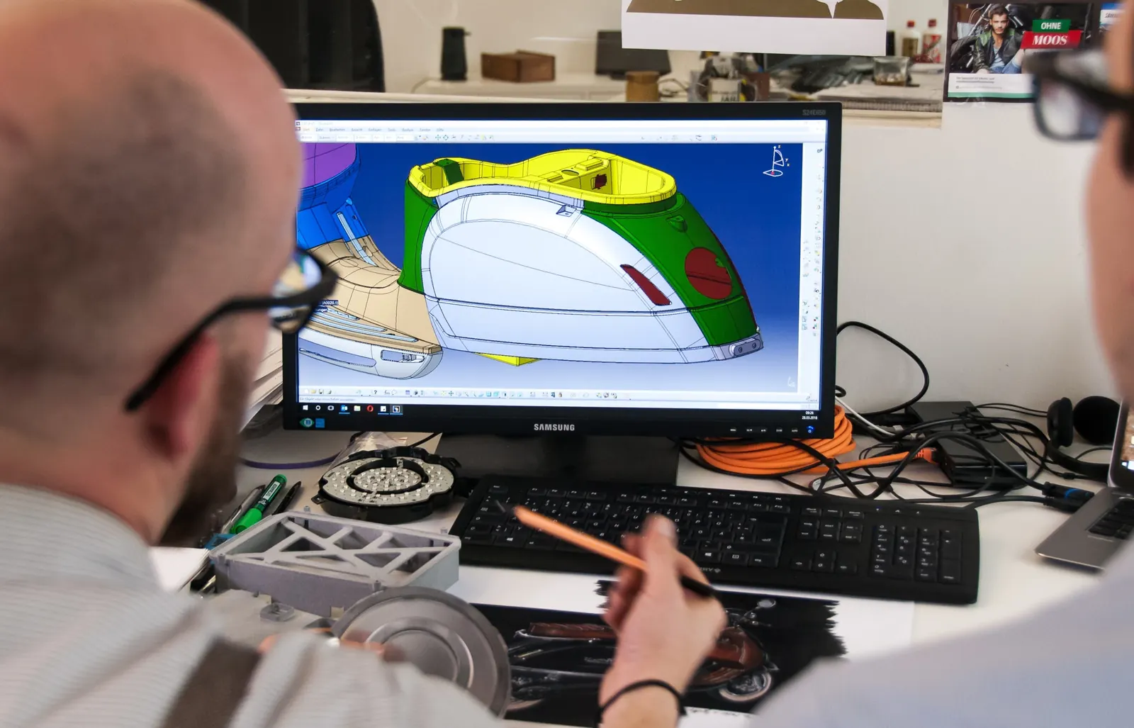 Engineer refining a product model in CAD software